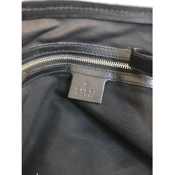 Renoveret gucci Taske i sort stof med skind bestning og 3 etuier medflgende